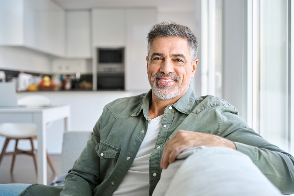 Middle-aged man sitting at the sofa - Intraoral Camera